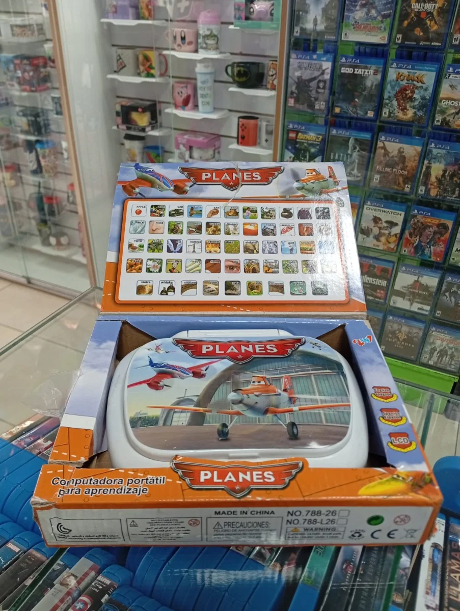 Computadora educativa Planes con palabras ilustradas